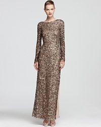 Aidan Mattox's shimmering gown dazzles in a long sleeve silhouette, modest from the front yet alluring with a deep v back. Aidan Mattox's shimmering gown dazzles in a long sleeve silhouette, modest from the front yet alluring with a deep v back.