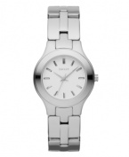 A tiny timepiece with big style. Watch by DKNY crafted of polished stainless steel bracelet and round case. Matte silver tone dial features stick indices, three hands and logo. Quartz movement. Water resistant to 50 meters. Two-year limited warranty.
