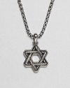 The familiar angles of the Star of David are intricately carved, set in polished sterling silver on a box-chain necklace.Sterling silverbulletNecklace, about 20 longPendant, about 1 wideLobster claspImported