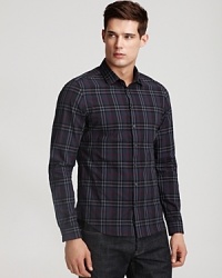 This cotton button down has a crumpled texture allover, a modern fit and Burberry's signature check pattern allover.