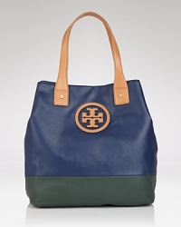 Take this season's color block trend with you anywhere and fill it with everything. This dipped canvas tote from Tory Burch flaunts practical style, sturdy trims, and a must-have mixed media finish.