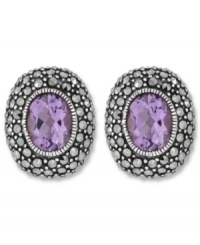 Perfect your look with polished studs. Genevieve & Grace's oval-shaped earrings feature amethyst centers (3-5/8 ct. t.w.) surrounded by glittering marcasite. Set in sterling silver. Earrings feature an omega clip-on backing for non-pierced ears. Approximate length: 3/4 inch. Approximate width: 5/8 inch. Perfect your look with polished studs. Genevieve & Grace's oval-shaped earrings feature amethyst centers (3-5/8 ct. t.w.) surrounded by glittering marcasite. Set in sterling silver. Earrings feature an omega clip-on backing for non-pierced ears. Approximate length: 3/4 inch. Approximate width: 5/8 inch.