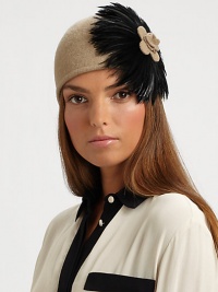 This wool-blend knit topper with large feather design is reminiscent of old Hollywood style.Pull-on style with concealed elastic band80% wool/20% polyesterDo not washImported This wool-blend knit topper with large feather design is reminiscent of old Hollywood style.Pull-on style with concealed elastic band80% wool/20% polyesterDo not washImported