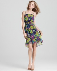 Enlivened by a vivid floral print and finished with a flouncy ruffle at the hem, this Ella Moss dress delights in feminine charm. Enlivened by a vivid floral print and finished with a flouncy ruffle at the hem, this Ella Moss dress delights in feminine charm.