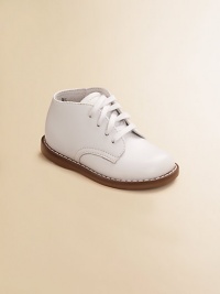 High-top lace-ups in supple leather provide excellent support and traction for youngsters' early steps. Adjustable front laces Padded insole Rubber traction sole Leather ImportedPlease note: It is recommended that you order ½ size smaller than measured. If your child measures a size 7.0, you may want to order a 6½. High-top lace-ups in supple leather provide excellent support and traction for youngsters' early steps. Adjustable front laces Padded insole Rubber traction sole Leather ImportedPlease note: It is recommended that you order ½ size smaller than measured. If your child measures a size 7.0, you may want to order a 6½.