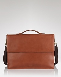 A sleek, modern briefcase with front flap and magnetic hook closure, top handle and logo embossed on front.