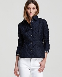 A wardrobe essential, this Burberry Brit quilted jacket sets the framework for smart, strong dressing. A wardrobe essential, this Burberry Brit quilted jacket sets the framework for smart, strong dressing.