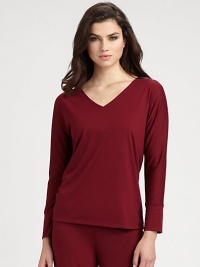 Ultra-soft stretch knit with a flattering neckline and long sleeves for the coziest evenings. V-neckLong sleevesBanded cuffsAbout 24 from shoulder to hemPolyester/rayon/spandexMachine washImported