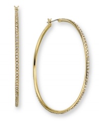Slip on these classic hoop earrings for carefree glamor and a hint of sparkle. In goldtone mixed metal with crystal accents. Measures approximately 2 inches. Slip on these classic hoop earrings for carefree glamor and a hint of sparkle. In goldtone mixed metal with crystal accents. Measures approximately 2 inches.