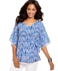 A vibrant print and feminine details mix marvelously on this Style&co. top, featuring a smocked empire waist and a flattering fit. A vibrant print and feminine details mix marvelously on this Style&co. top, featuring a smocked empire waist and a flattering fit.
