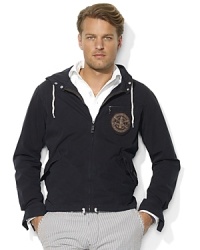 Stylish and functional, a classic windbreaker is updated for modern, laid-back style in lightweight cotton canvas. Stylish and functional, a classic windbreaker is updated for modern, laid-back style in lightweight cotton canvas.