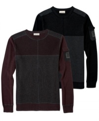 This pieced and color-blocked sweater from DKNY Jeans offers a modern look and a warm cozy feel. This pieced and color-blocked sweater from DKNY Jeans offers a modern look and a warm cozy feel.