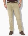 Casual pants tailored from sun-faded mid-weight chino, designed for authentic five-pocket styling and a straight leg. Standard-rise belted waist with Ralph Lauren's signature shank closure. Five-pocket jean styling with signature metal rivets. Flat-front with a timeworn, vintage feel.