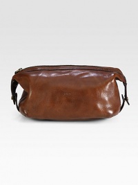 An impeccably stylish carrying case for the modern gentleman, this lightweight pouch in a leather construction provides sharp transport for essential toiletries.Zip closureAntiqued brass hardwareEmbossed logo accents at the exteriorLeather9W x 5HImported An impeccably stylish carrying case for the modern gentleman, this lightweight pouch in a leather construction provides sharp transport for essential toiletries.Zip closureAntiqued brass hardwareEmbossed logo accents at the exteriorLeather9W x 5HImported
