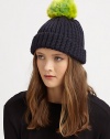 A cozy knit topper with a bold pom-pom for a simple, yet stylish, accessory.7 longMerino woolHand washImported