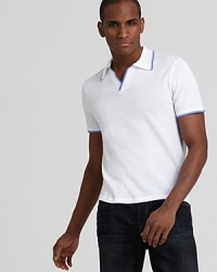 A classic tennis polo from Michael Kors gets the modern treatment with a trim fit for a vintage-inspired style. A classic tennis polo from Michael Kors gets the modern treatment with a trim fit for a vintage-inspired style.