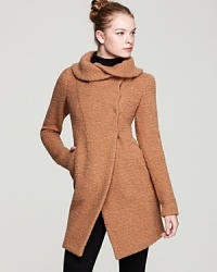 An elegant shawl collar brings a chic twist to this bouclé Dawn Levy coat blending rich texture with a sleek shape . An elegant shawl collar brings a chic twist to this bouclé Dawn Levy coat blending rich texture with a sleek shape .