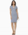 Chic rope accents and bold variegated stripes lend sophisticated nautical style to Lauren Jeans Co.'s hooded dress, constructed in ultra-soft cotton jersey for stylish comfort and versatility.