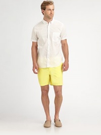 A vibrant summer essential, sport this garment dyed twill short with half-back elastic waist for added comfort.Flat-front styleSide slash, back welt pocketsInseam, about 6CottonMachine washMade in USA