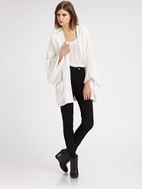 Inspired by the traditional kimono, this elegant topper is slightly oversized with wide bell sleeves and a stylish open front.Dropped shouldersWide kimono sleevesOpen frontHip patch pocketsSilk liningAbout 31 from shoulder to hemRayonMachine washImported Inspired by the traditional kimono, this elegant topper is slightly oversized with wide bell sleeves and a stylish open front.Dropped shouldersWide kimono sleevesOpen frontHip patch pocketsSilk liningAbout 31 from shoulder to hemRayonMachine washImported