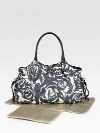 It looks like an elegant tote but it's really a full-featured baby bag with places for everything you and your little one need when you're out and about.Double top handles It looks like an elegant tote but it's really a full-featured baby bag with places for everything you and your little one need when you're out and about.Double top handles