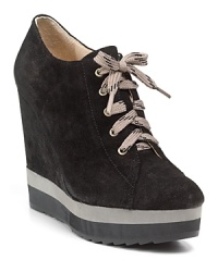Sport-inspired laces and a striped wedge lend covetable details to the Wendolyn wedges from Boutique 9. Sport-inspired laces and a striped wedge lend covetable details to the Wendolyn wedges from Boutique 9.