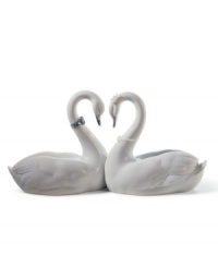 Exquisitely crafted of porcelain, the Endless Love figurine by Lladro presents a pair of snowy swans united in love. Designed as a wedding cake topper, or a bridal or anniversary gift, this heirloom quality collectible will be cherished for generations to come. 5.25 x 10.5. Exquisitely crafted of porcelain, the Endless Love figurine by Lladro presents a pair of snowy swans united in love. Designed as a wedding cake topper, or a bridal or anniversary gift, this heirloom quality collectible will be cherished for generations to come. 5.25 x 10.5.