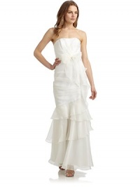 THE LOOKMermaid silhouetteStrapless straight necklineInterior boning Cross-over pleated bodice Self-tie belt Tiered skirtTulle hem underlayBack pleatsBack zip closureTHE FITAbout 50 from top to hemTHE MATERIALSilkFully linedCARE & ORIGINDry cleanImportedModel shown is 5'10 (177cm) wearing US size 4. THE LOOKMermaid silhouetteStrapless straight necklineInterior boning Cross-over pleated bodice Self-tie belt Tiered skirtTulle hem underlayBack pleatsBack zip closureTHE FITAbout 50 from top to hemTHE MATERIALSilkFully linedCARE & ORIGINDry cleanImportedModel shown is 5'10 (177cm) wearing US size 4.