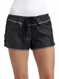 THE LOOKNarrow elastic waistband with drawstringContrast pipingLace-up sidesBack zip pocketTHE FITRise, about 9Inseam, about 1½THE MATERIALPolyester/nylonFully linedCARE & ORIGINHand washMade in USAModel shown is 5'10 (172½cm) wearing US size Small. THE LOOKNarrow elastic waistband with drawstringContrast pipingLace-up sidesBack zip pocketTHE FITRise, about 9Inseam, about 1½THE MATERIALPolyester/nylonFully linedCARE & ORIGINHand washMade in USAModel shown is 5'10 (172½cm) wearing US size Small.