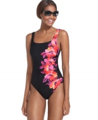 A tropical floral print brightens up Miraclesuit's flattering ruched one-piece tank suit. A tropical floral print brightens up Miraclesuit's flattering ruched one-piece tank suit.