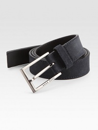 A brilliant, logo embossed silver buckle fastens this wardrobe essential of soft suede.SuedeAbout 1 wideImported