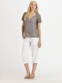 This airy knit with a hint of shimmer, thanks to metallic thread, also features a feminine neckline and beloved fit.V-neckShort sleevesPull-on styleAbout 24 from shoulder to hem83% linen/16% metallic thread/1% cottonHand washImported of Italian fabric Model shown is 5'10 (177cm) wearing US size Small. This airy knit with a hint of shimmer, thanks to metallic thread, also features a feminine neckline and beloved fit.V-neckShort sleevesPull-on styleAbout 24 from shoulder to hem83% linen/16% metallic thread/1% cottonHand washImported of Italian fabric Model shown is 5'10 (177cm) wearing US size Small.
