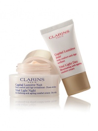 Clarins' exclusive pioneer plant extracts help defy dark spots, dullness and wrinkles for a smooth, unified skin tone. Visibly lifts, firms and restores the deep luminosity of young-looking skin. Duo includes: Full-size Vital Light Night Revitalizing Anti-Aging Cream and travel-size Vital Light Day Illuminating Anti-Aging Cream. Made in France. Clarins' exclusive pioneer plant extracts help defy dark spots, dullness and wrinkles for a smooth, unified skin tone. Visibly lifts, firms and restores the deep luminosity of young-looking skin. Duo includes: Full-size Vital Light Night Revitalizing Anti-Aging Cream and travel-size Vital Light Day Illuminating Anti-Aging Cream. Made in France.