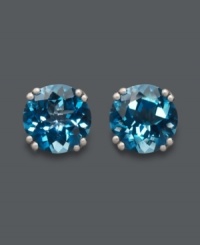 Dip into cool, blue hues. Round-cut London blue topaz (4-1/2 ct. t.w.) stud earrings are certain to make a splash! Crafted in 14k white gold. Approximate diameter: 8 mm.