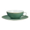 Embellished with an organically complex basket weave pattern and rendered in gold-tipped turquoise, the Reynaud Tresor tea saucer lends boho-chic sophistication to the dining table.