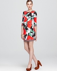 Emblazoned with a vividly hued floral print, this Trina Turk dress works the sunny season with flat sandals, then wows with opaque tights and booties come fall. Emblazoned with a vividly hued floral print, this Trina Turk dress works the sunny season with flat sandals, then wows with opaque tights and booties come fall.