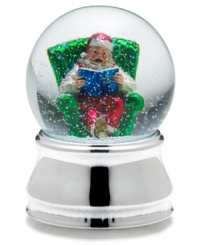 Santa Claus kicks back with a good book, full of beautiful Christmas stories, in this musical snow globe from Towle. Santa Claus kicks back with a good book, full of beautiful Christmas stories, in this musical snow globe from Towle.