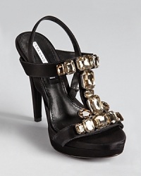 Jeweled details add a sparkling touch to sumptuous satin on Vera Wang Lavender Label's Shannon sandals. Jeweled details add a sparkling touch to sumptuous satin on Vera Wang Lavender Label's Shannon sandals.