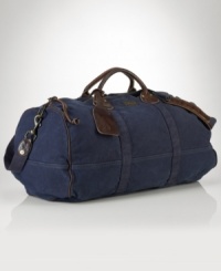 Ideal for travel, a rugged canvas duffle gets a luxe update from rich leather handles. Ideal for travel, a rugged canvas duffle gets a luxe update from rich leather handles.