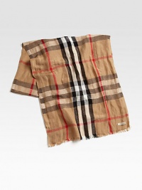 Remarkable blend of linen and silk in a classic oversized check pattern with fringed edges.Fringed ends18 x 7055% linen/45% silkDry cleanMade in Italy Remarkable blend of linen and silk in a classic oversized check pattern with fringed edges.Fringed ends18 x 7055% linen/45% silkDry cleanMade in Italy