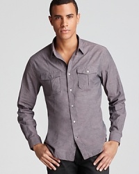 Front and back darts help shape the silhouette of this handsome button-down for a slimmer fit, and a solid, understated color provides versatility. Front and back darts help shape the silhouette of this handsome button-down for a slimmer fit, and a solid, understated color provides versatility.