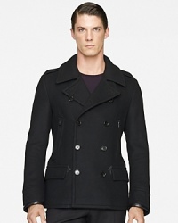 Sophisticated and sleek, this handsome pea coat in warm wool exudes modern luxury in a trim silhouette with supple leather trim. Sophisticated and sleek, this handsome pea coat in warm wool exudes modern luxury in a trim silhouette with supple leather trim.