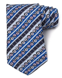 Flowers float in circles among ornate stripes and vibrant colors on this exciting silk tie from Emilio Pucci for a powerful contribution to your refined wardrobe. Flowers float in circles among ornate stripes and vibrant colors on this exciting silk tie from Emilio Pucci for a powerful contribution to your refined wardrobe.