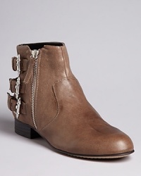 Buckle up and take these Dolce Vita booties for a spin; they're one casual pair with triple the appeal. Buckle up and take these Dolce Vita booties for a spin; they're one casual pair with triple the appeal.