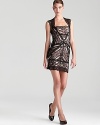 In allover lace, Nicole Miller's sleeveless dress showcases an alluring back cutout.