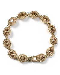 Always have something sparkly up your sleeve with this gleaming bracelet from Carolee, featuring topaz-toned stones and shapely stations. Always have something sparkly up your sleeve with this gleaming bracelet from Carolee, featuring topaz-toned stones and shapely stations.