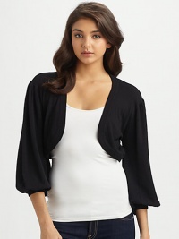 Sculptural and chic, finished with dramatic bolero sleeves.Rib-knit edges and cuffsThree-quarter blouson sleevesAbout 15 from shoulder to hemRayonImportedDry clean