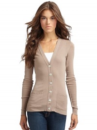 THE LOOKFinely ribbed designV-neck Front button closure Long sleeves Front patch pockets Exposed seam details THE FITAbout 26 from shoulder to hemTHE MATERIALCottonCARE & ORIGINDry cleanImportedModel shown is 5'11 (180cm) wearing US size Small. THE LOOKFinely ribbed designV-neck Front button closure Long sleeves Front patch pockets Exposed seam details THE FITAbout 26 from shoulder to hemTHE MATERIALCottonCARE & ORIGINDry cleanImportedModel shown is 5'11 (180cm) wearing US size Small.
