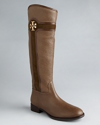 Tory Burch signature logos highlight mixed-media, tonal shafts in riding boots that will end up with lots of mileage. Tory Burch signature logos highlight mixed-media, tonal shafts in riding boots that will end up with lots of mileage.