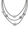 A classic illusion necklace encounters a modern twist. Majorica design features three rows of Baroque, organic, man-made pearls (12 mm) strung on edgy, black leather cords. Approximate length: 18 inches + 2-inch extender. Approximate drop: 3 inches.
